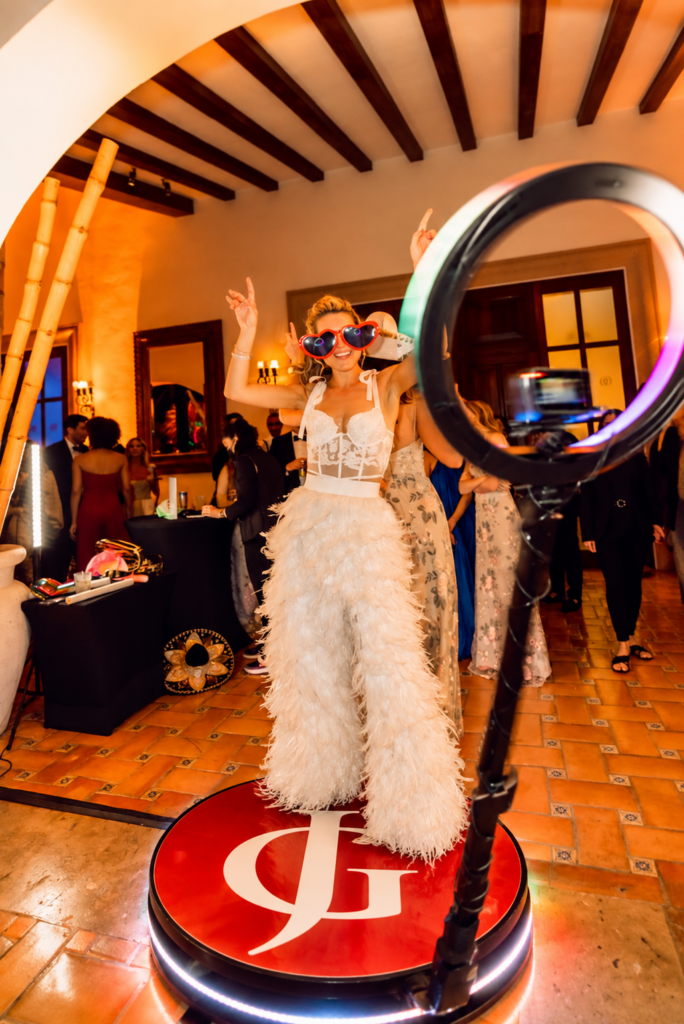 Bride posing on the Just Great Events 360 photo booth platform in Toronto