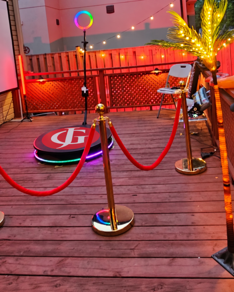 360 photo booth with red carpet and rope barriers set up at a Toronto venue