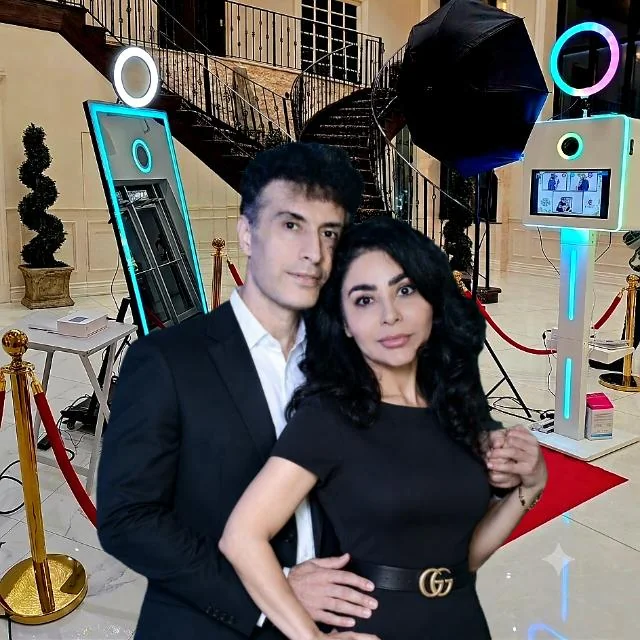 Just Great Events owners in front of mirror and 360 photo booths at a Toronto venue