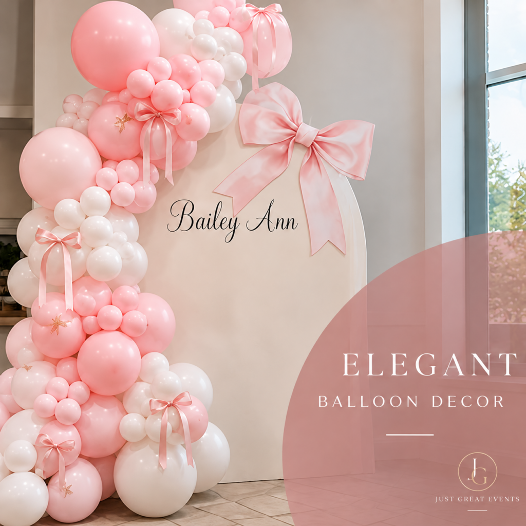 Elegant pink and white balloon decor with a custom name backdrop