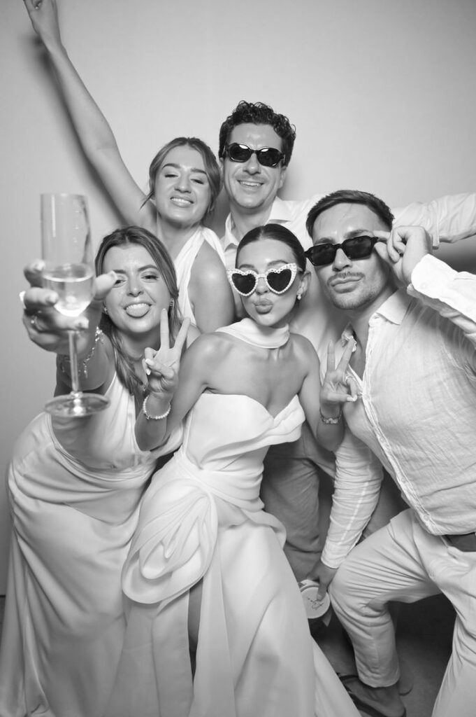 Wedding party celebrating in a black and white Glam Booth photo in Toronto