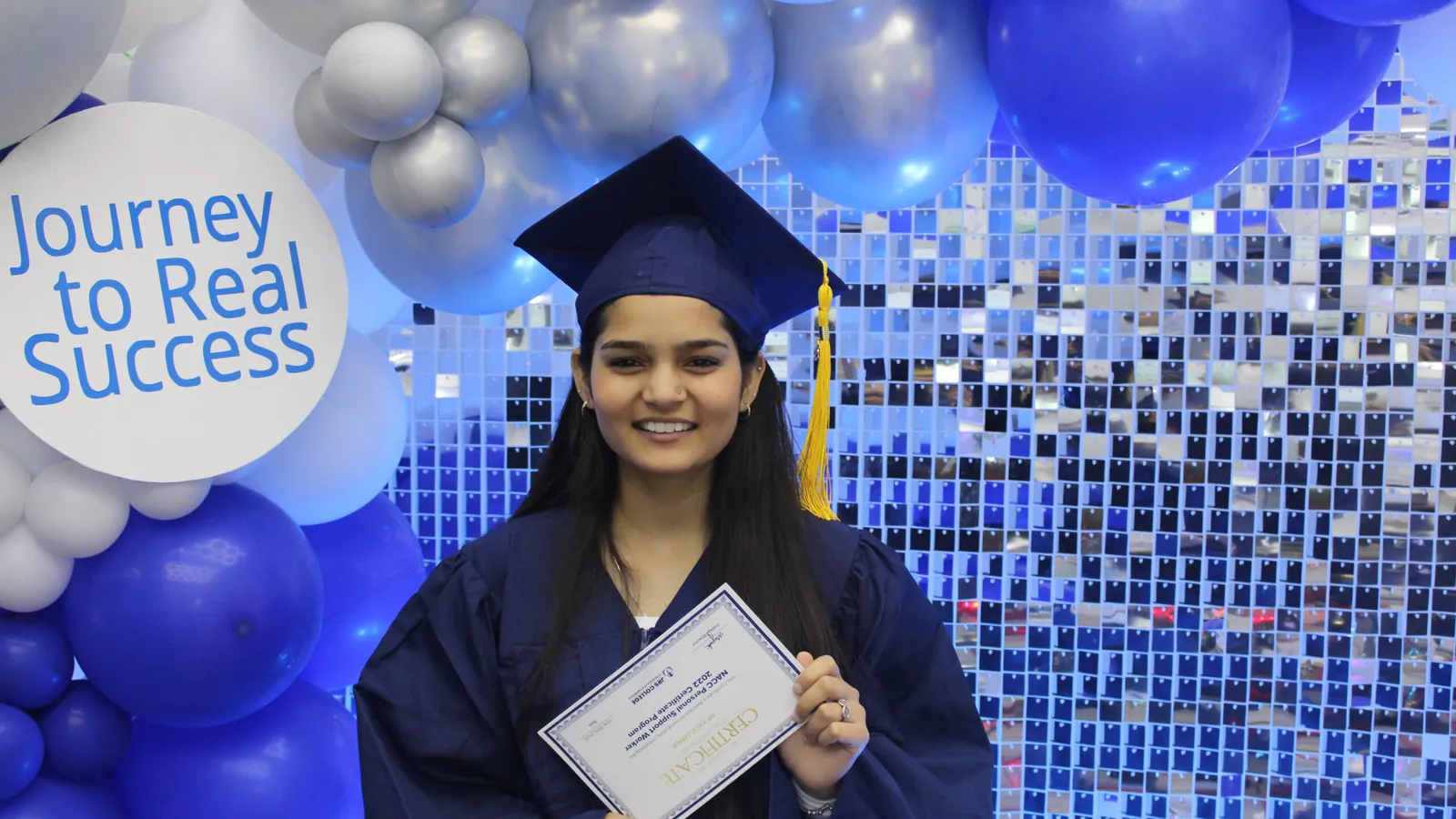 Graduates at a photo booth in Hamilton