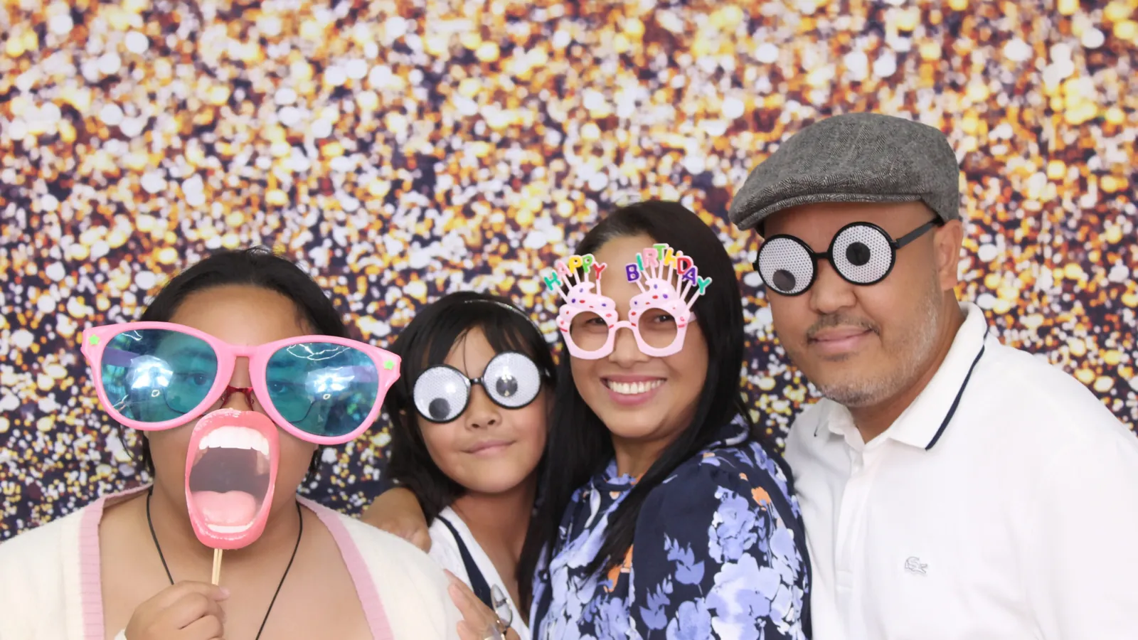 Guests with props at a photo booth in Toronto