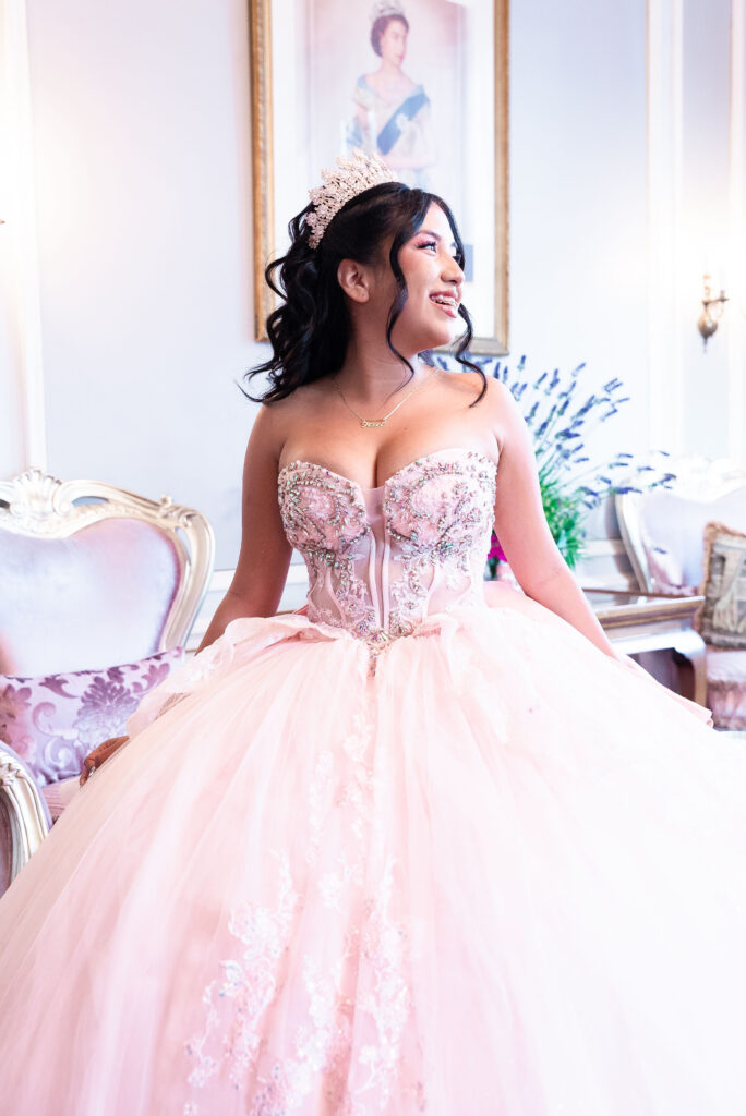 Quinceañera portrait in a pink ball gown