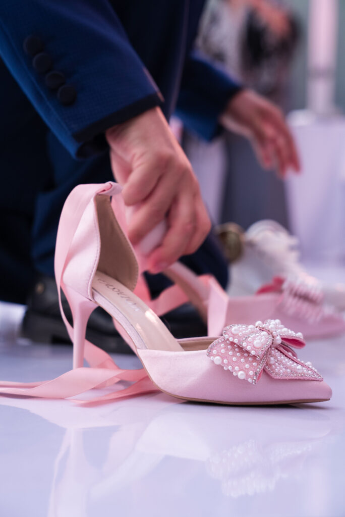 Quinceañera shoe ceremony detail captured by our event photographer