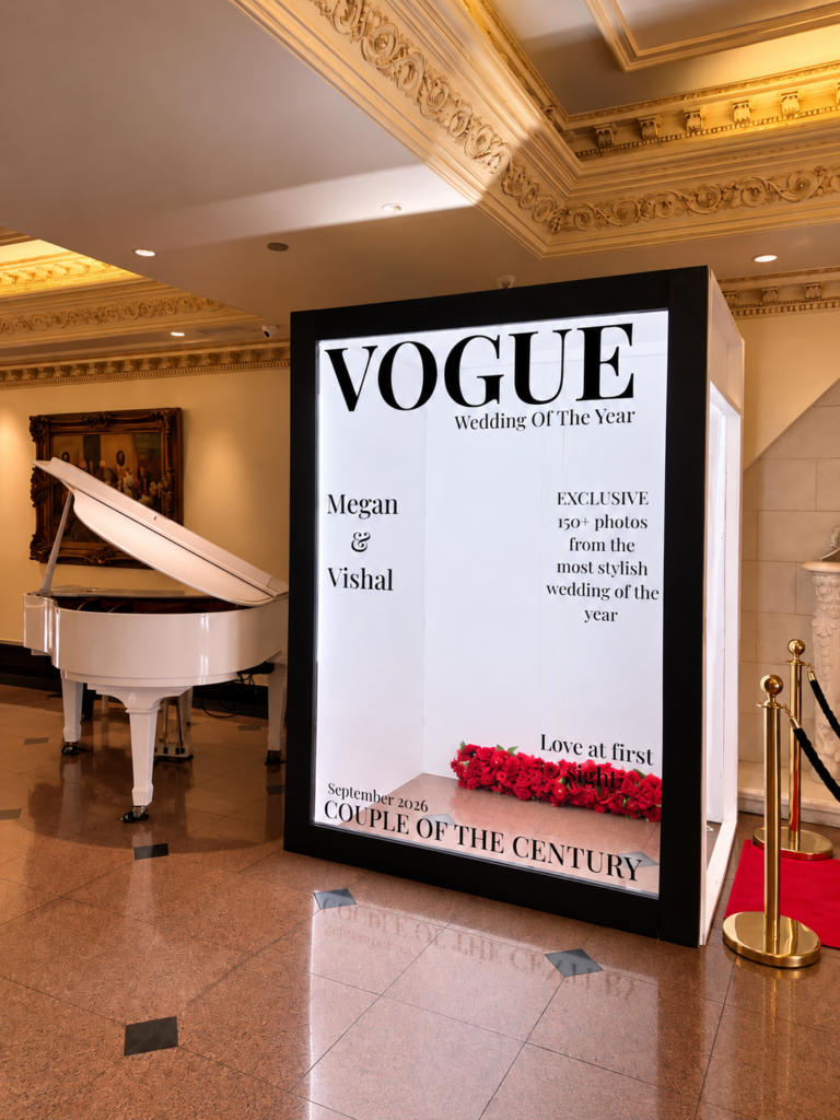 Magazine cover photo booth in a ballroom with a grand piano