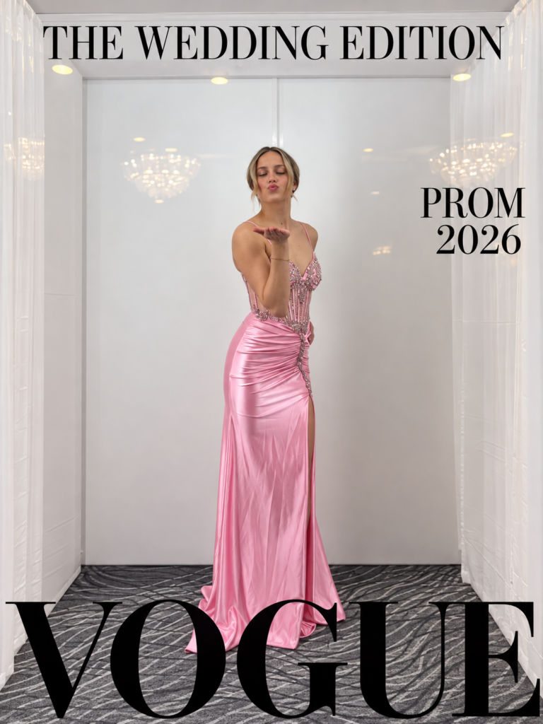 Prom guest posing in a Wedding Edition magazine cover photo booth