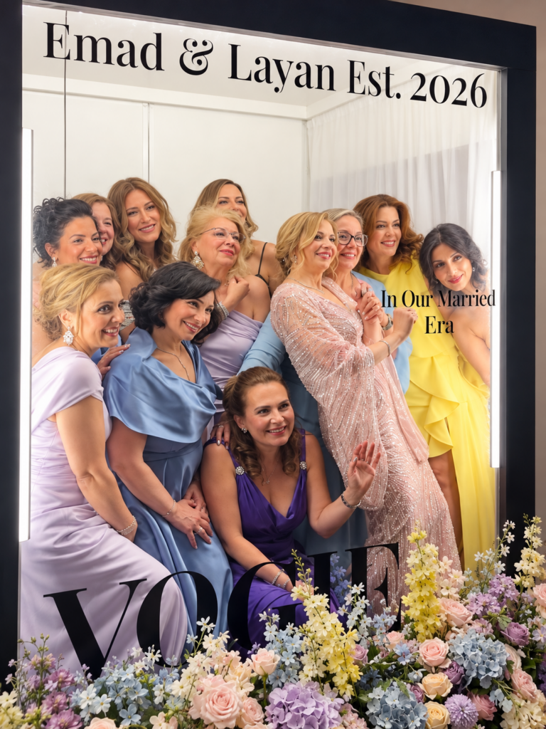 Wedding guests posing inside a magazine cover photo booth in Toronto