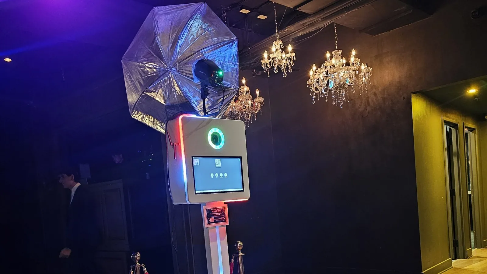 Signature Classic photo booth with ring light under chandeliers at a Toronto wedding reception